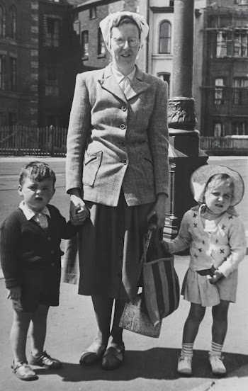 Woman Holding Children's Hands