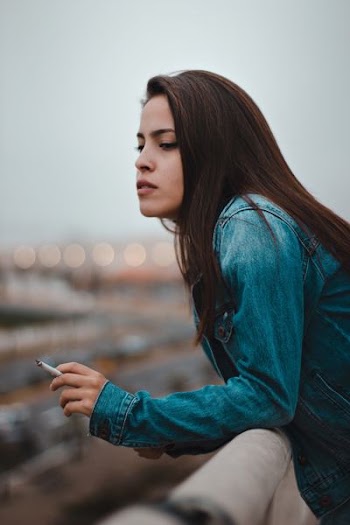 woman holding cigarette