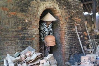 Woman Holding Clay Pots