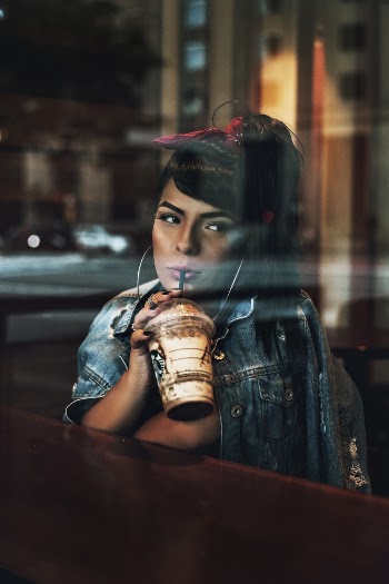 Woman Holding Clear Disposable Cup