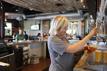 Woman Holding Clear Glass Cup