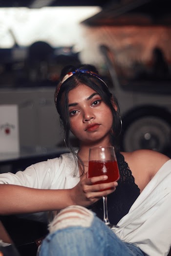 Woman Holding Clear Long-stem Wine Glass