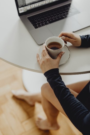 Woman Holding Cup