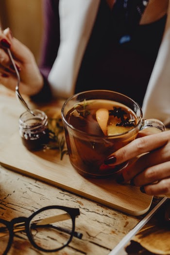 Woman Holding Cup of Tea