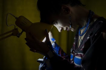 Woman Holding Desk Lamp