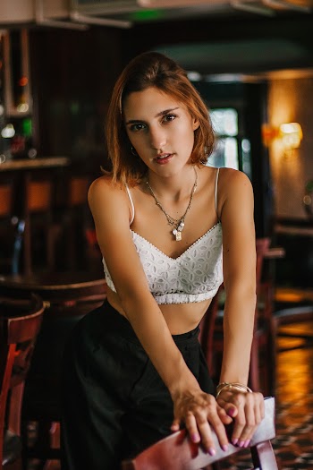Woman Holding Dining Chair
