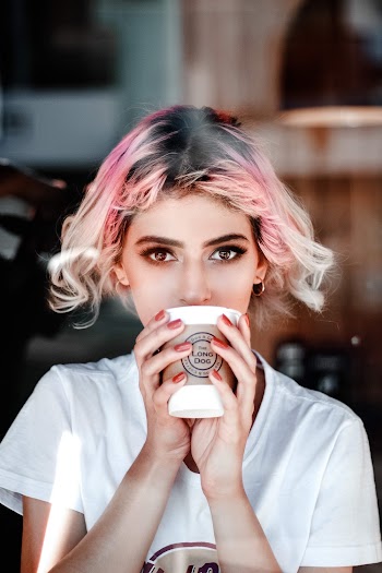 Woman Holding Disposable Cup
