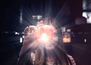woman holding donut