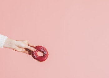 Woman Holding Doughnut