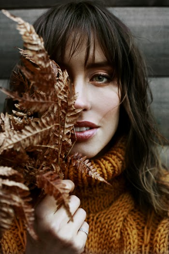 Woman Holding Dried Leaves