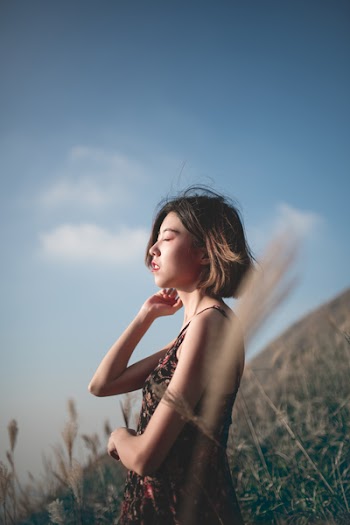 Woman Holding Ear