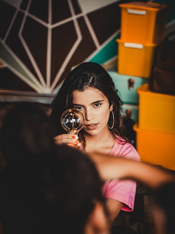 Woman Holding Edison Light Bulb