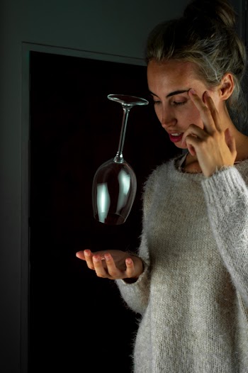 Woman Holding Eye and Concentrating