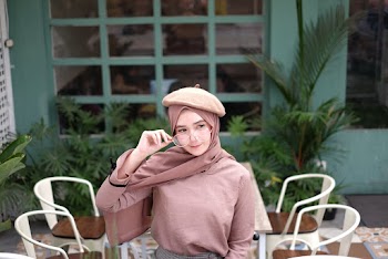 Woman Holding Eyeglasses