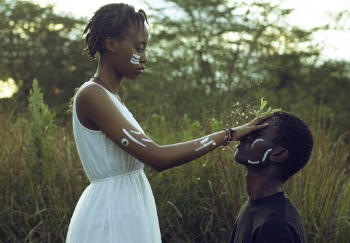 Woman Holding Face of Man
