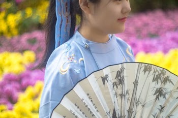 woman holding fan