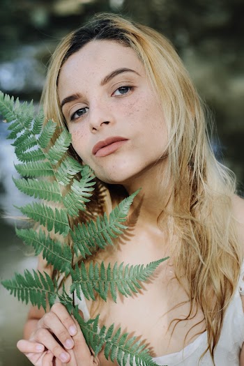 Woman Holding Fern Plant