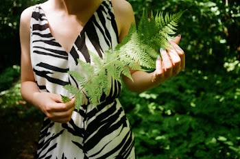Woman Holding Fern Plant