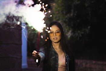 Woman Holding Fire Cracker