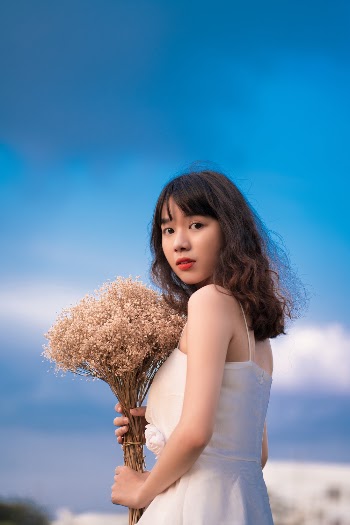 Woman Holding Flowers