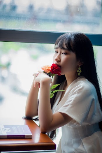 Woman Holding Flowers