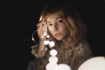 Woman Holding Forehead at Night