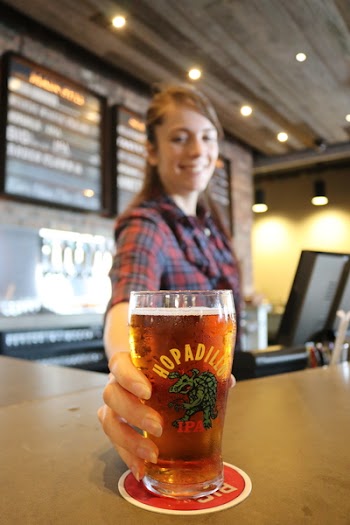Woman Holding Glass Bottle With Beer