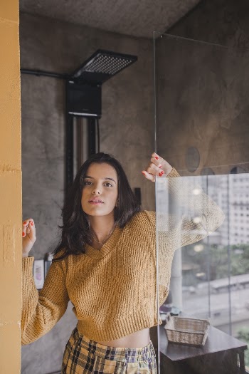 Woman Holding Glass Wall