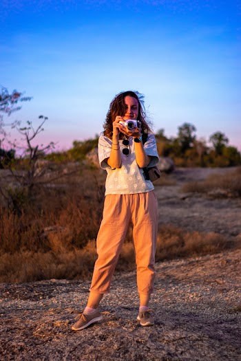 Woman Holding Gray Camera