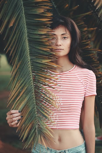 Woman Holding Green Leaf