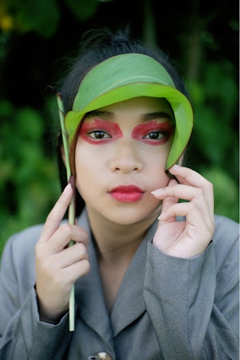 Woman Holding Green Leaf