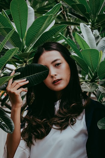 Woman Holding Green Leaf