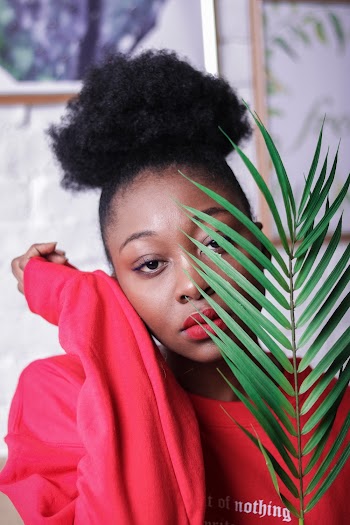 Woman Holding Green Leaves