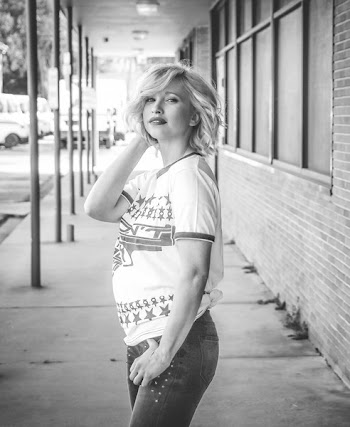 Woman Holding Hair and Jeans Pocket Grayscale Photo