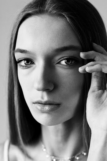 Woman Holding Hair in Close-up Photo