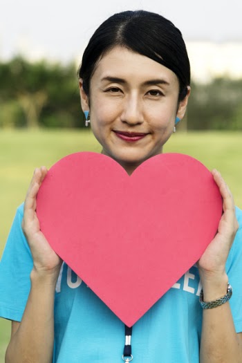 Woman Holding Heart Cut-out