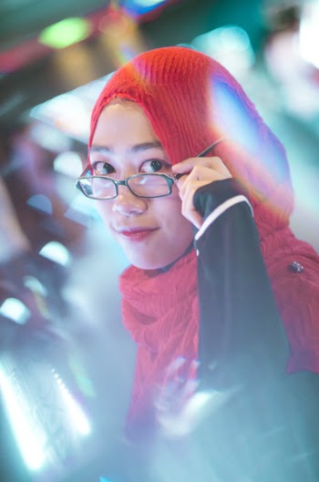 Woman Holding Her Black Framed Eyeglasses