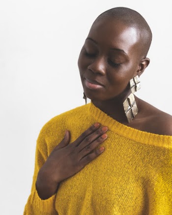Woman Holding Her Chest