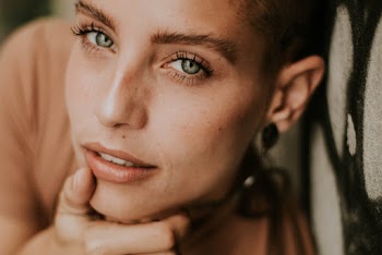 Woman Holding Her Chin