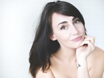 Woman Holding Her Chin With White Background