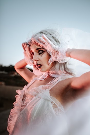 Woman Holding Her Face