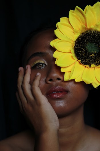 Woman Holding Her Face