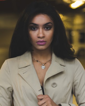 Woman Holding Her Gray Blazer