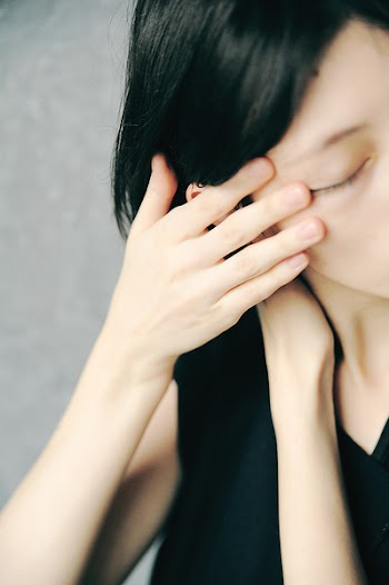 Woman Holding Her Hair