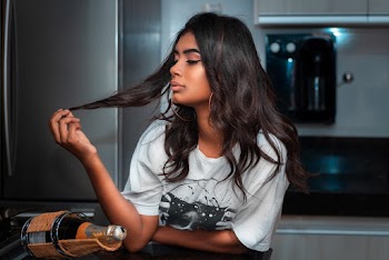 Woman Holding Her Hair Inside Room