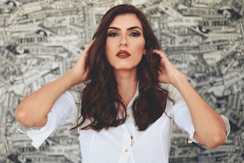 Woman Holding Her Hair Looking Straight