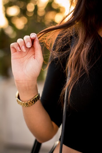 Woman Holding Her Hair While Wearing Black Crop- Top