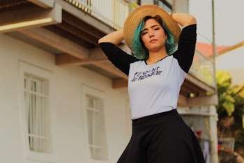 Woman Holding Her Hat 