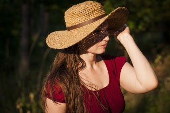 Woman Holding Her Hat