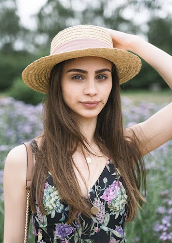 Woman Holding Her Hat